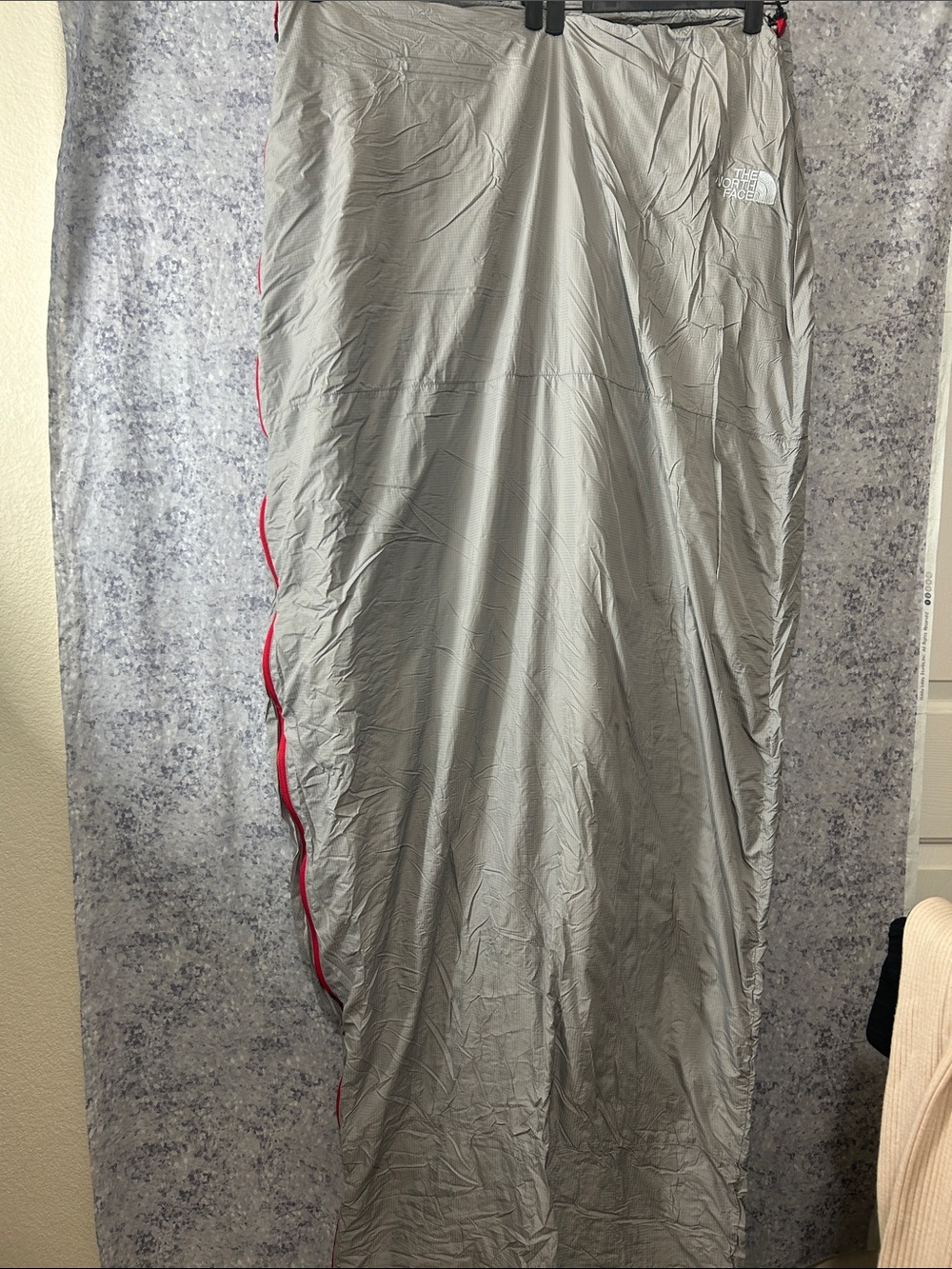 The North Face Light Gray Sleeping Bag with Red